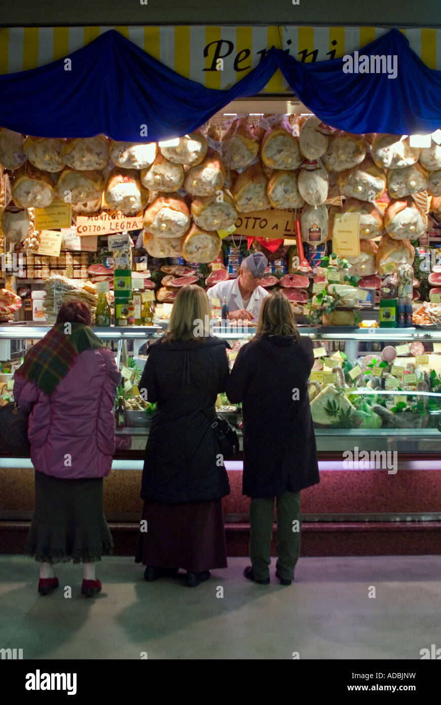 Vertical close up of customers at a traditional Italian delicatessen