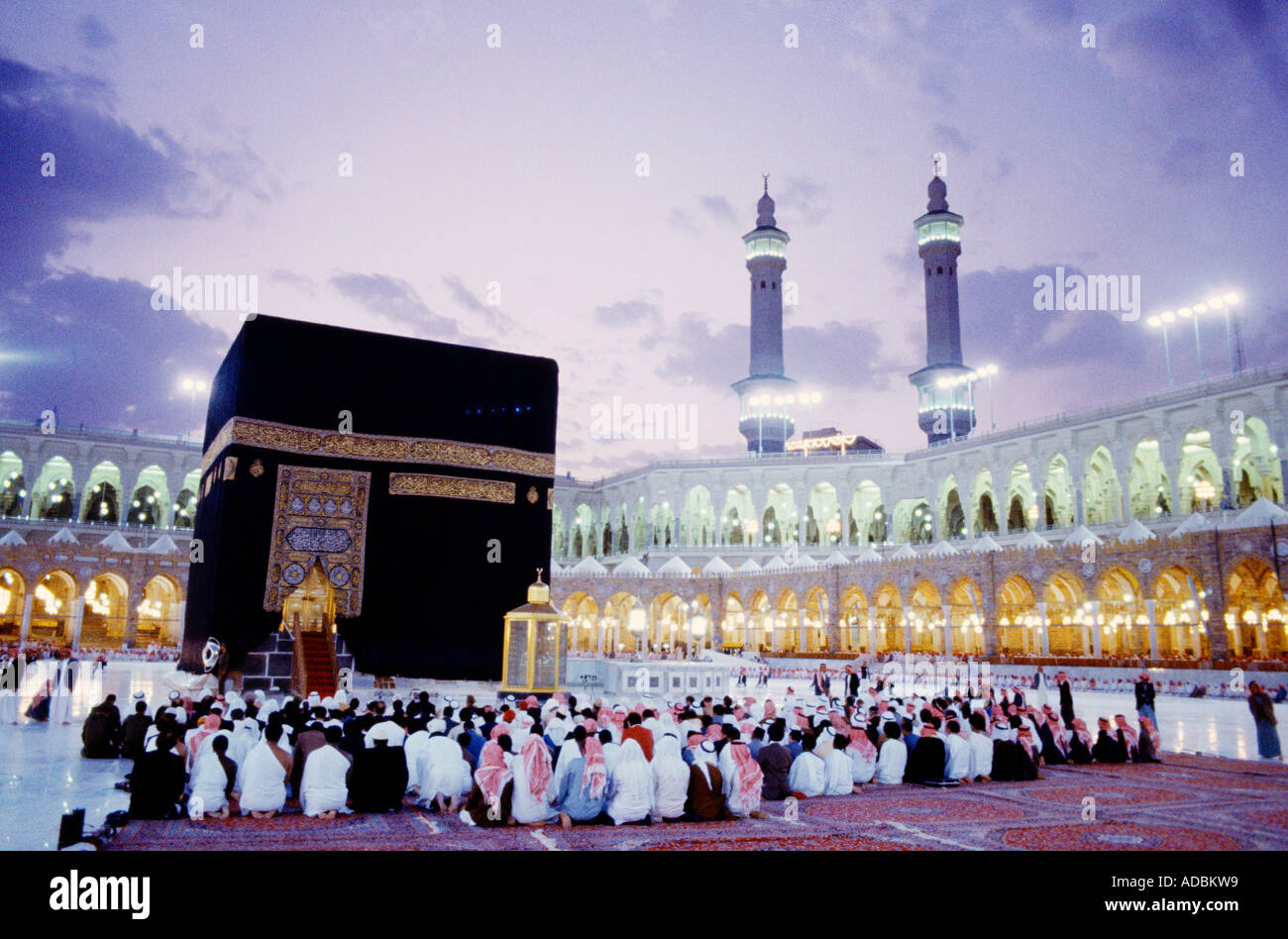 Makkah Saudi Arabia Hajj Pilgrims Kneeling by the Kaaba in Masjid al-Haram Stock Photo