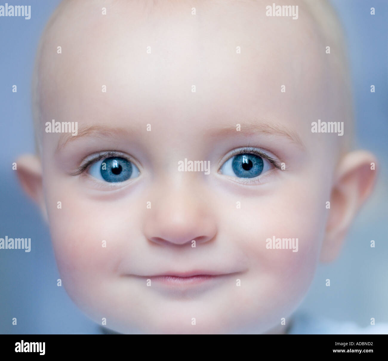10 month old baby boy with bright blue eyes Stock Photo - Alamy