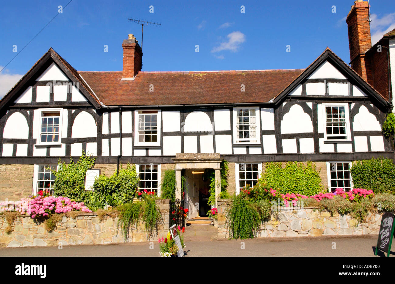 Large house of timber frame and stone construction in Broad Street Weobley Herefordshire England UK GB EU Stock Photo