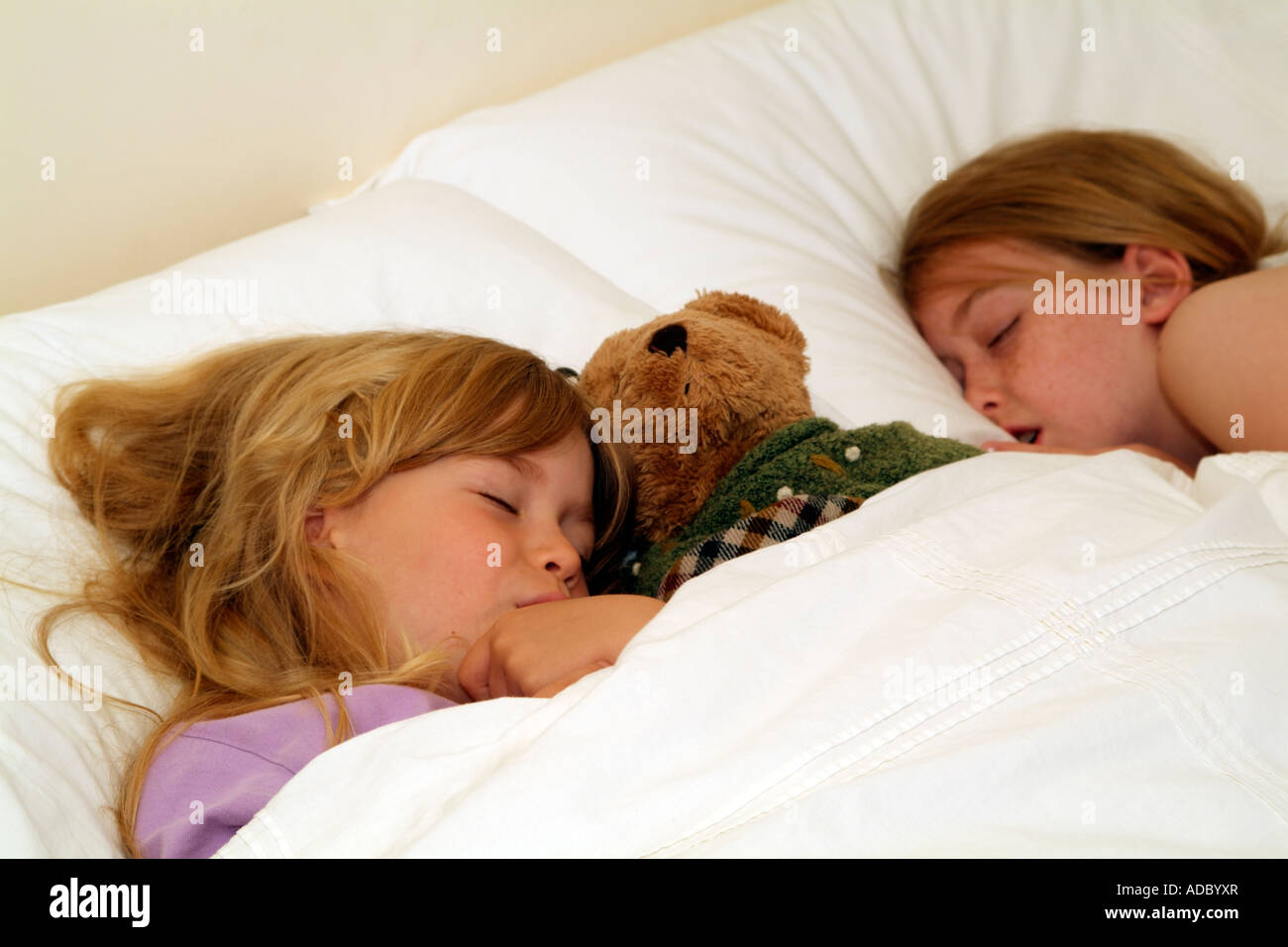 Children sleeping on pillow in bed Little girls fast asleep Stock Photo Alamy