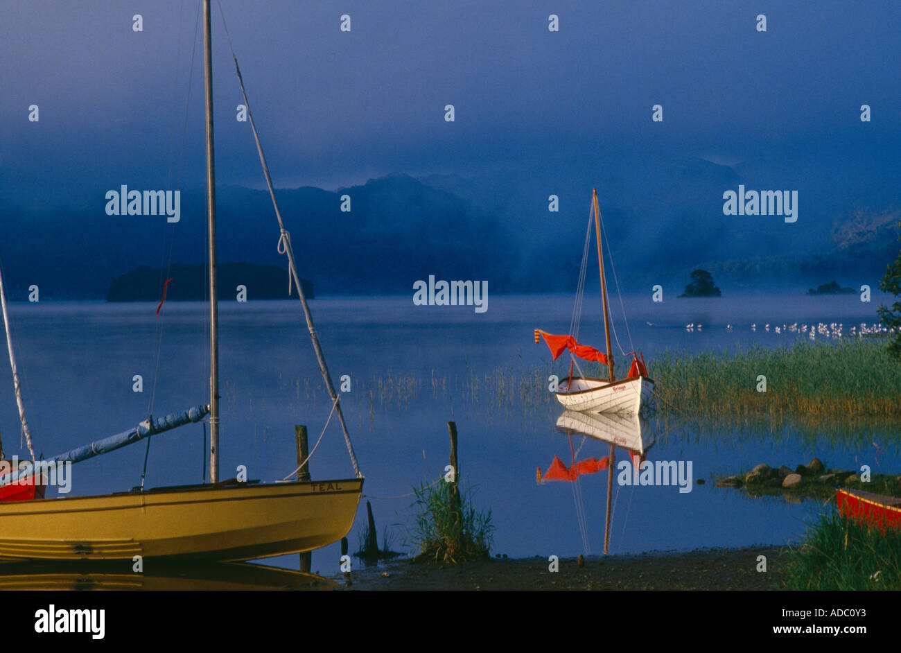 boats on Derwentwater nr Keswick at dawn Lake District Cumbria England UK Stock Photo