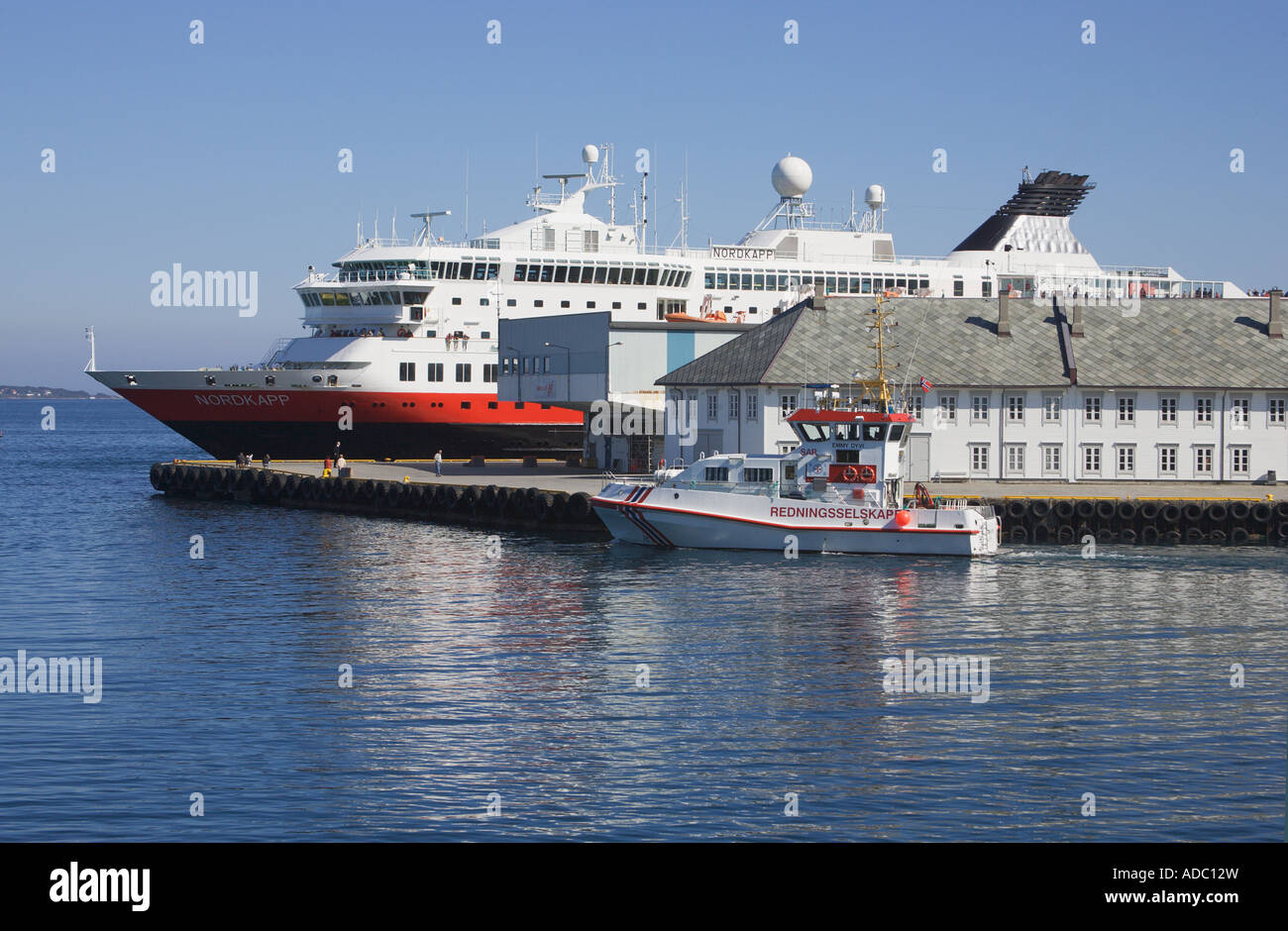 The Hurtigruten coastal steamer moored at the harbour Alesund More og Romsdal Norway Stock Photo
