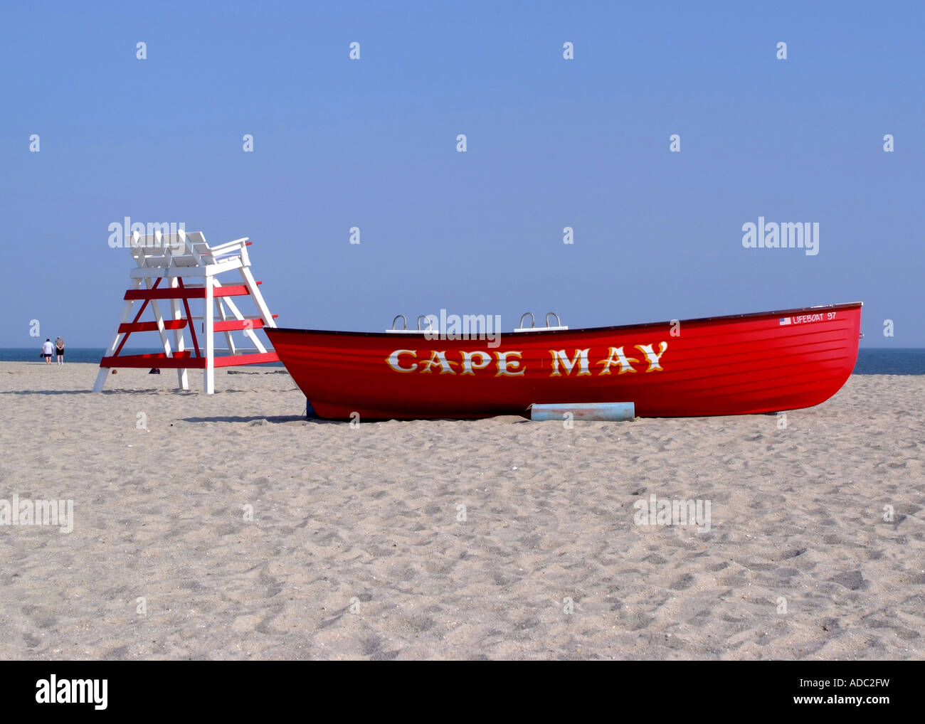 Bright Red Lifeboat and Empty Lifeguards Raised Chair on Beach at Cape ...