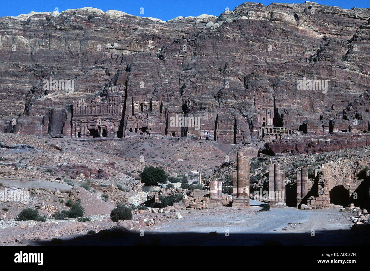 Old stone carved dwellings and tombs in ancient archeological city in ...