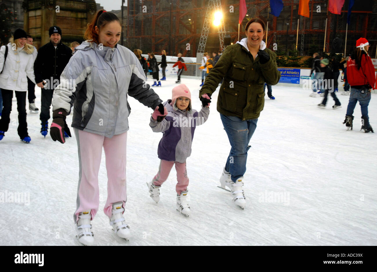 Ice Skating on Outdoor Ice Rink, Square. City Chambers in