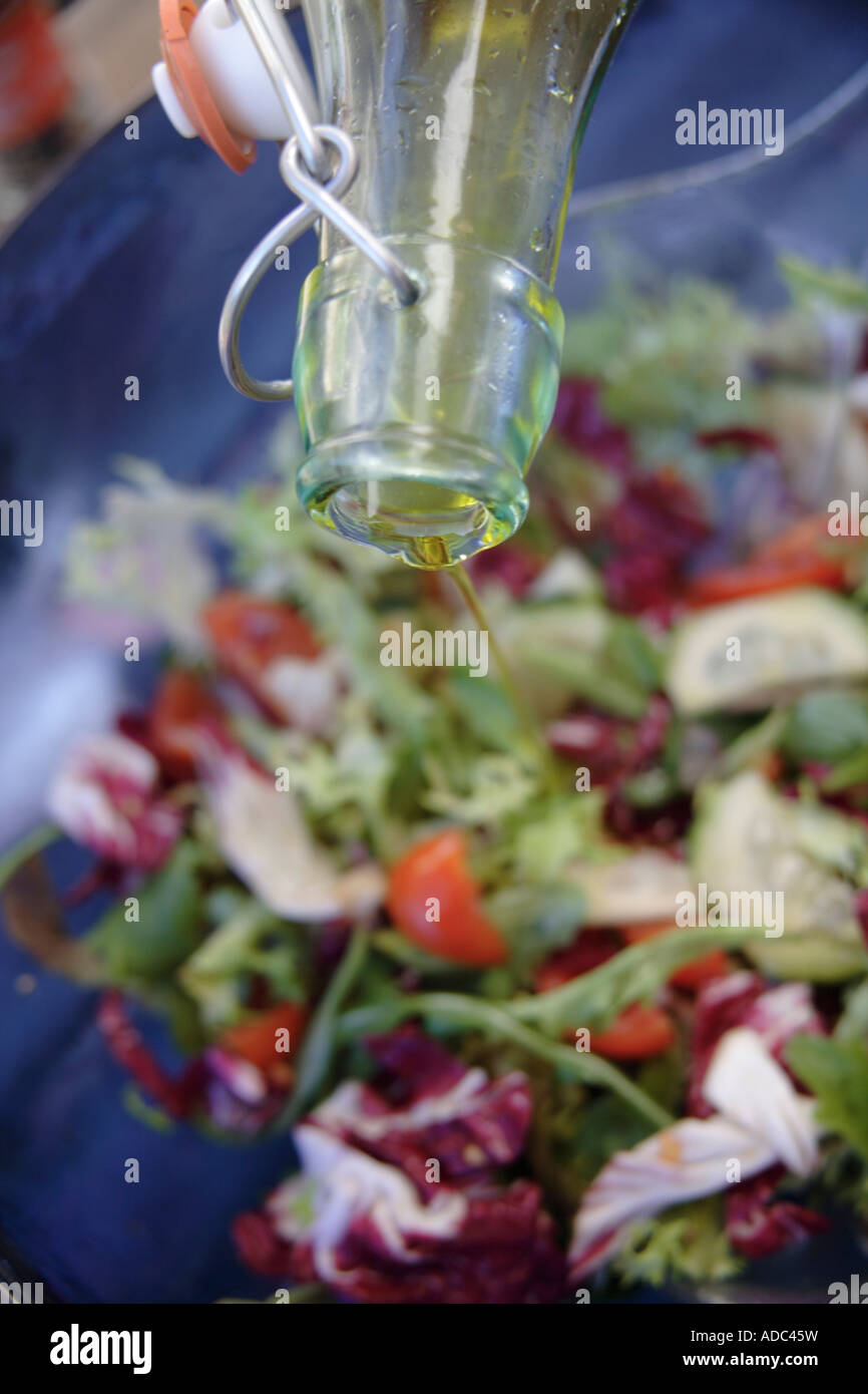 Adding Fresh Oil Preparing fresh salad: adding olive oil Stock Photo - Alamy