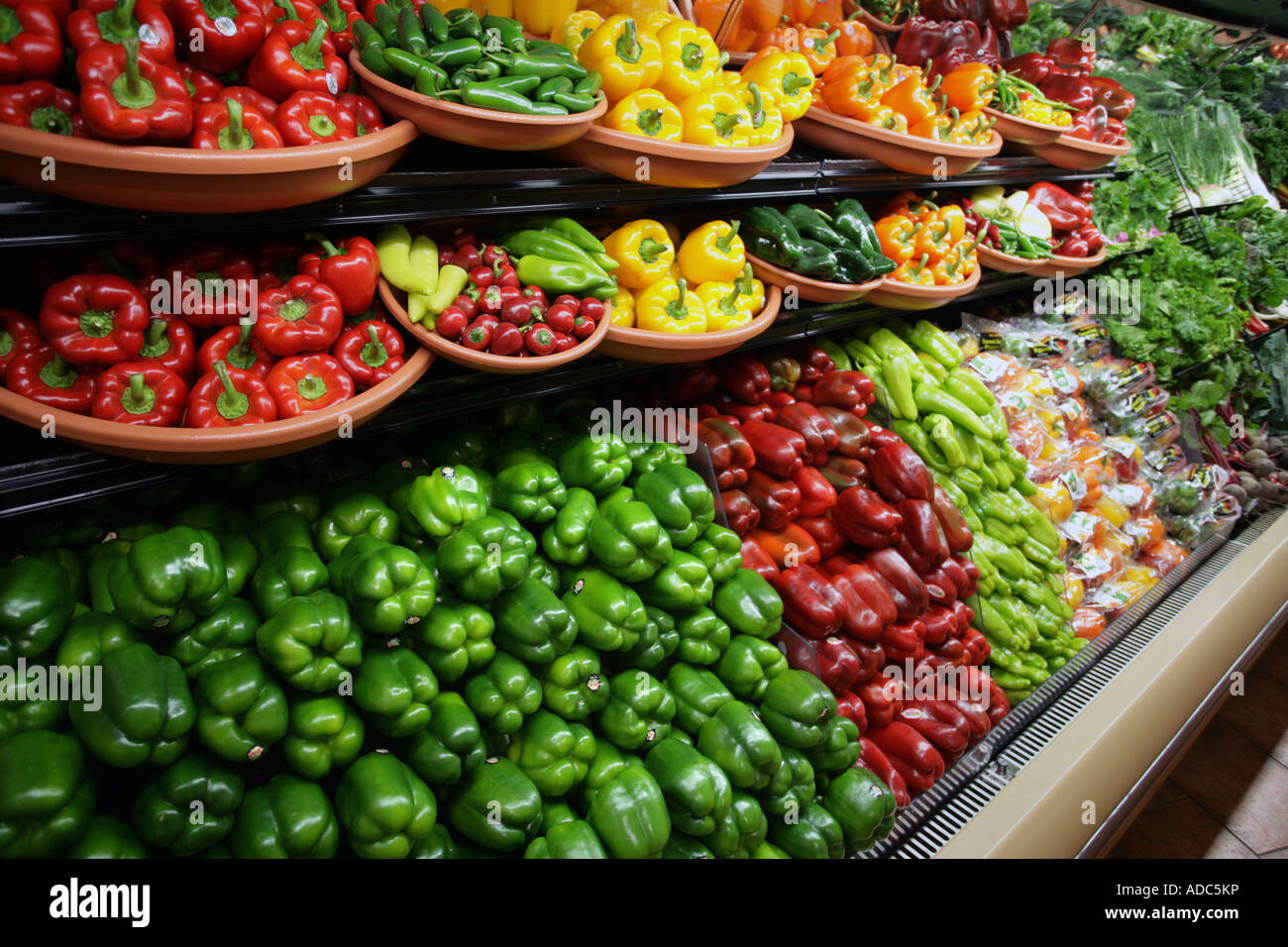 Rows of Colorful peppers for sale in a large Supermarket in the USA