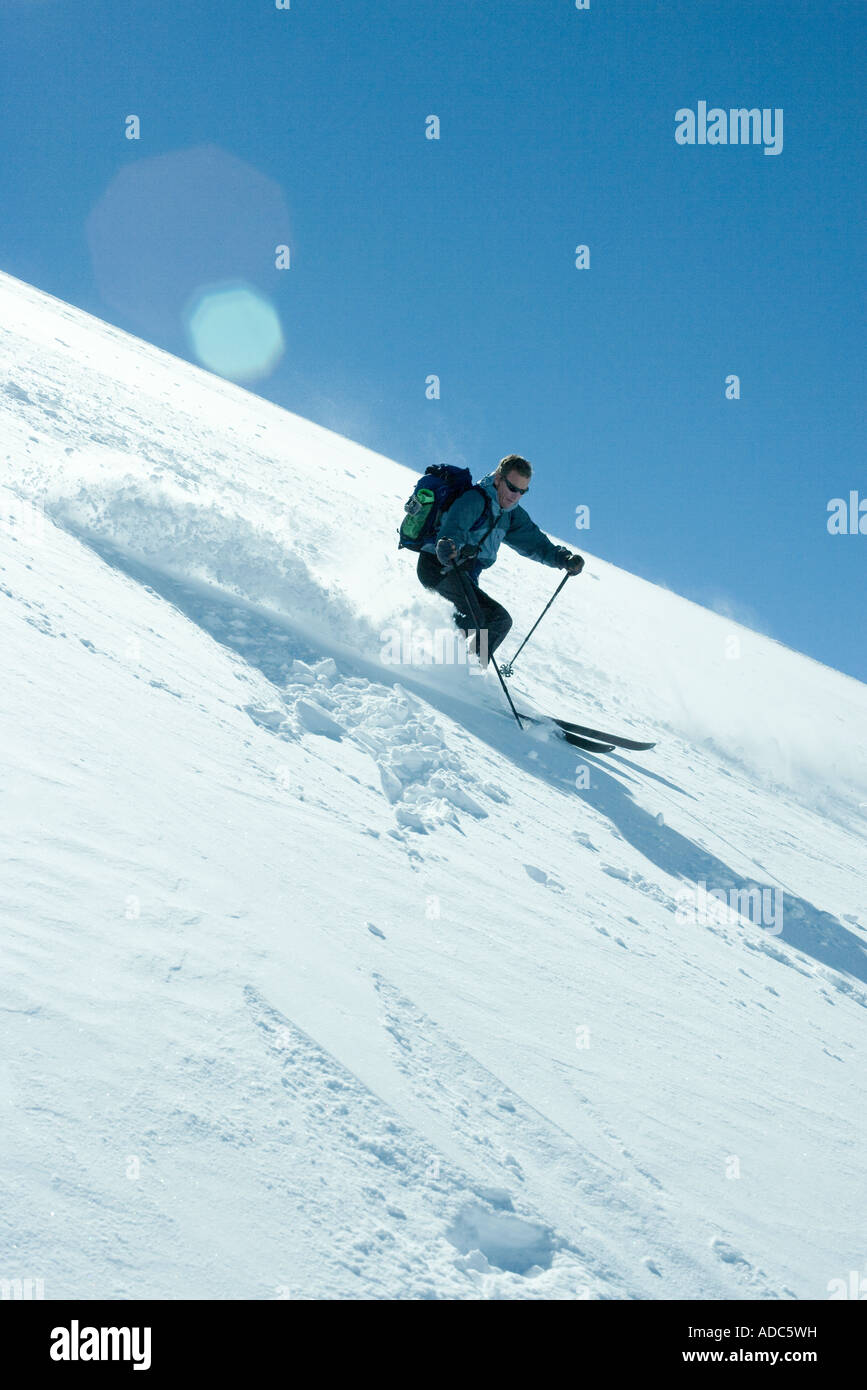 Skier skiing downhill Stock Photo Alamy