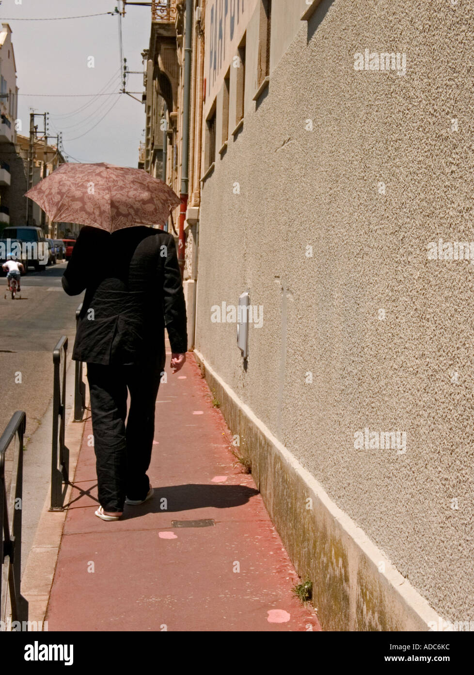 Pedestrian carrying umbrella hi-res stock photography and images - Alamy