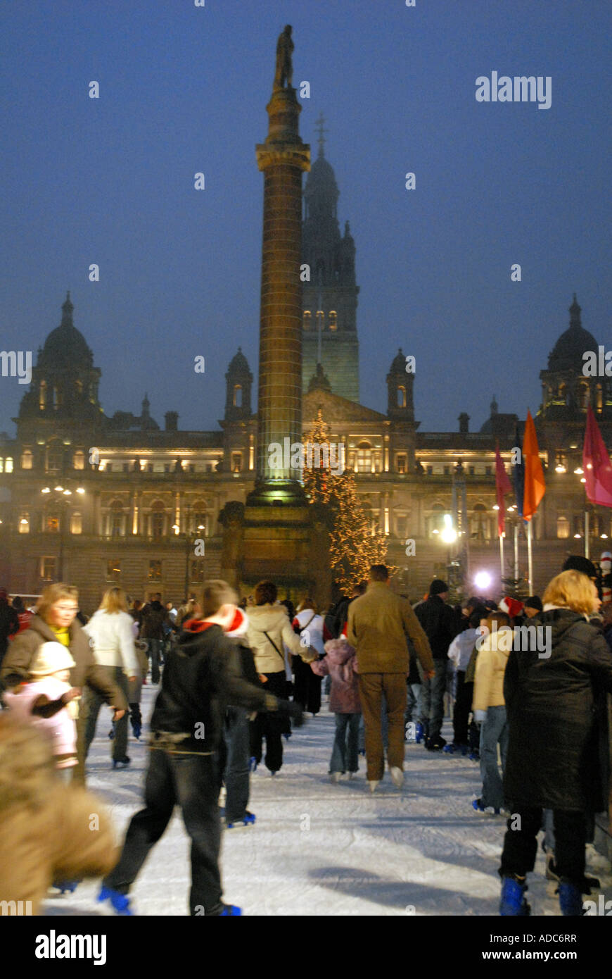 Ice Skating on Outdoor Ice Rink, Square. City Chambers in