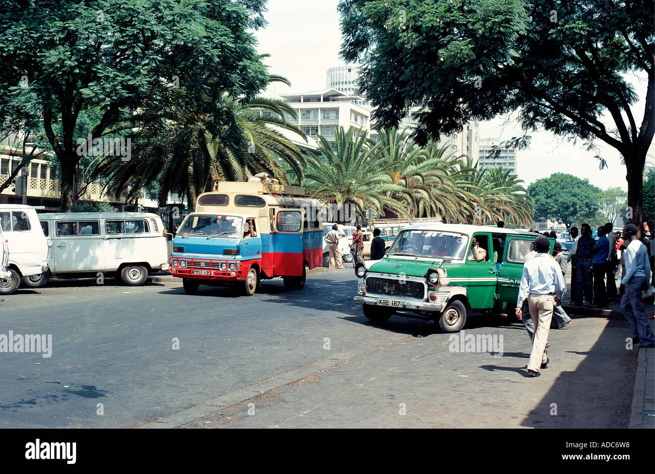 MATATUS or cheap local taxis or minibuses loading passengers on Moi Avenue in central Nairobi Kenya East Africa Stock Photo