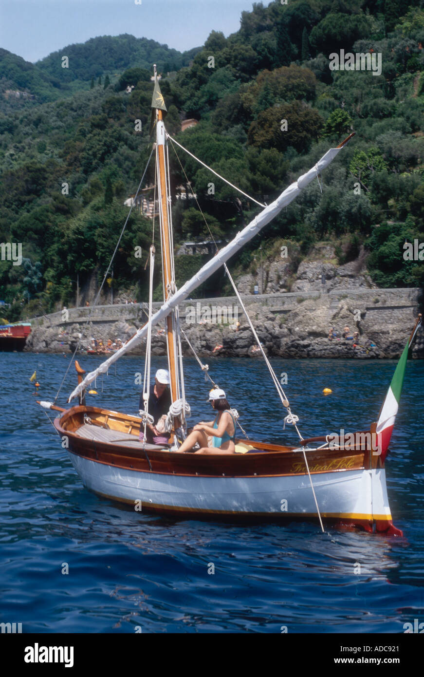 A modern but traditionally styled gozzo lateen rigged sailing boat near Rapallo in Italy Europe Stock Photo