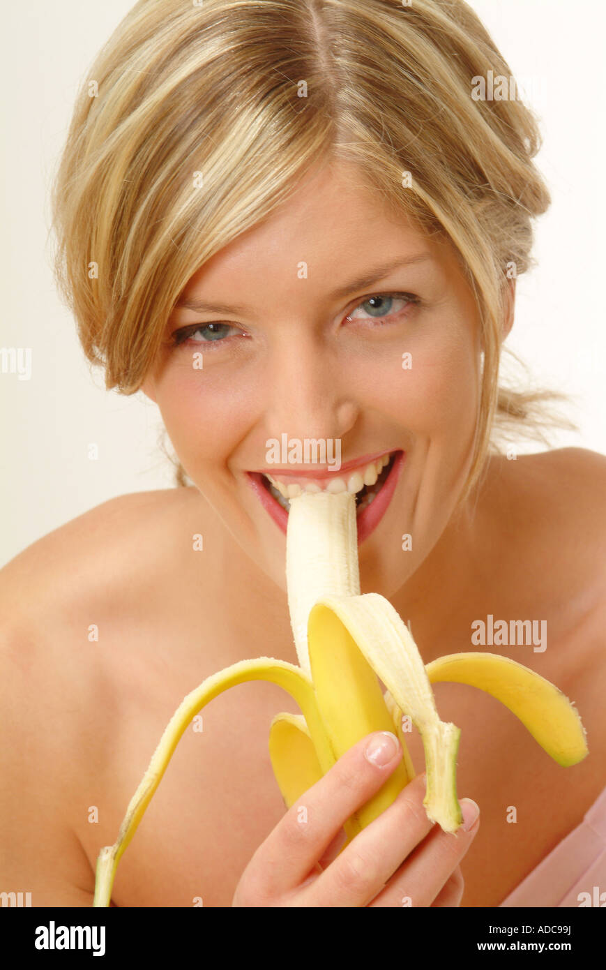 Portrait Of Woman Eating Banana Stock Photo Alamy