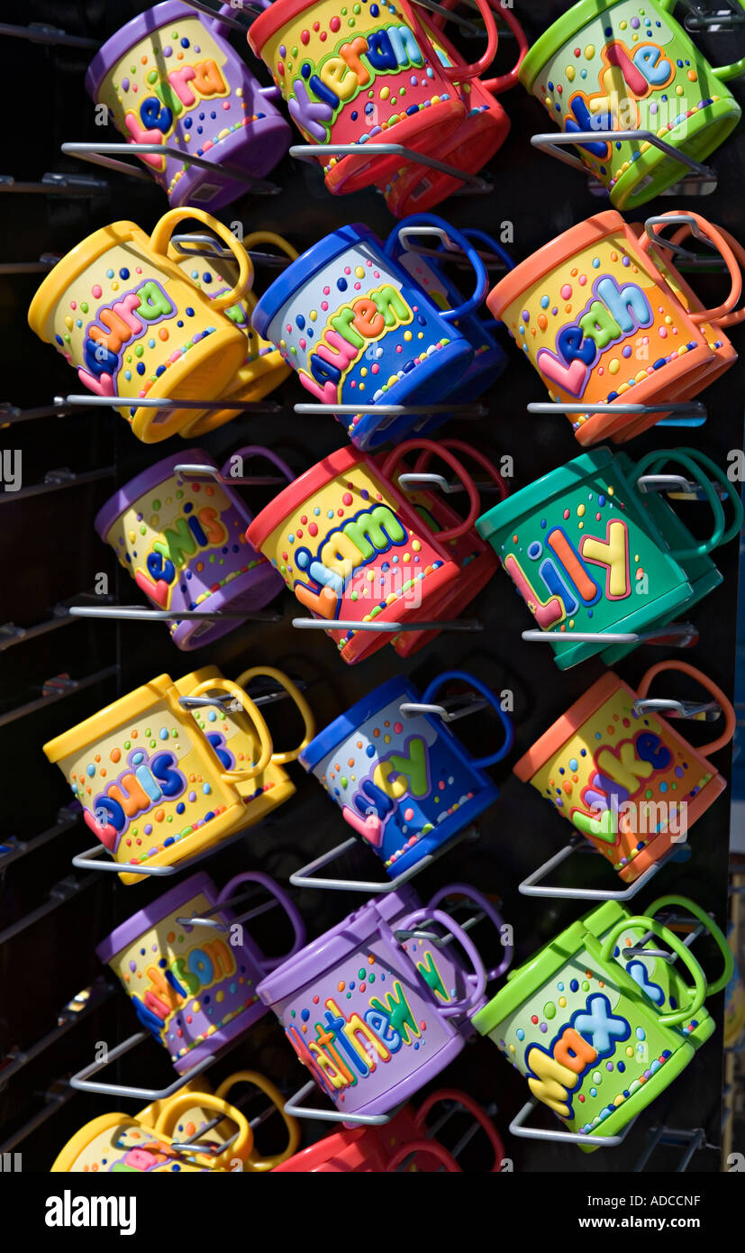 Names on mugs on sale on a rack Llandudno Wales UK Stock Photo