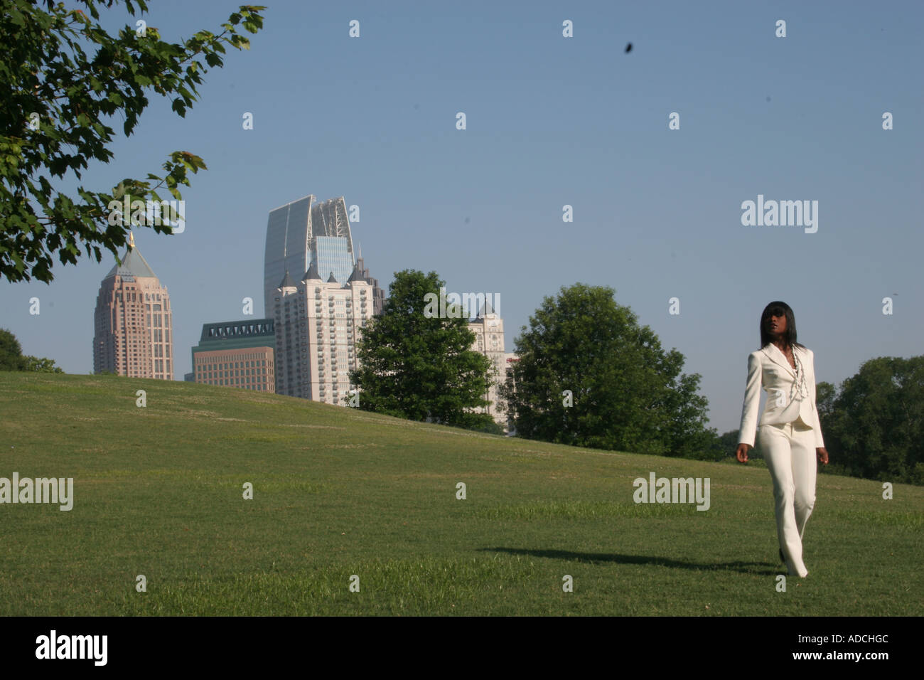 African woman walking in suit hi-res stock photography and images - Alamy
