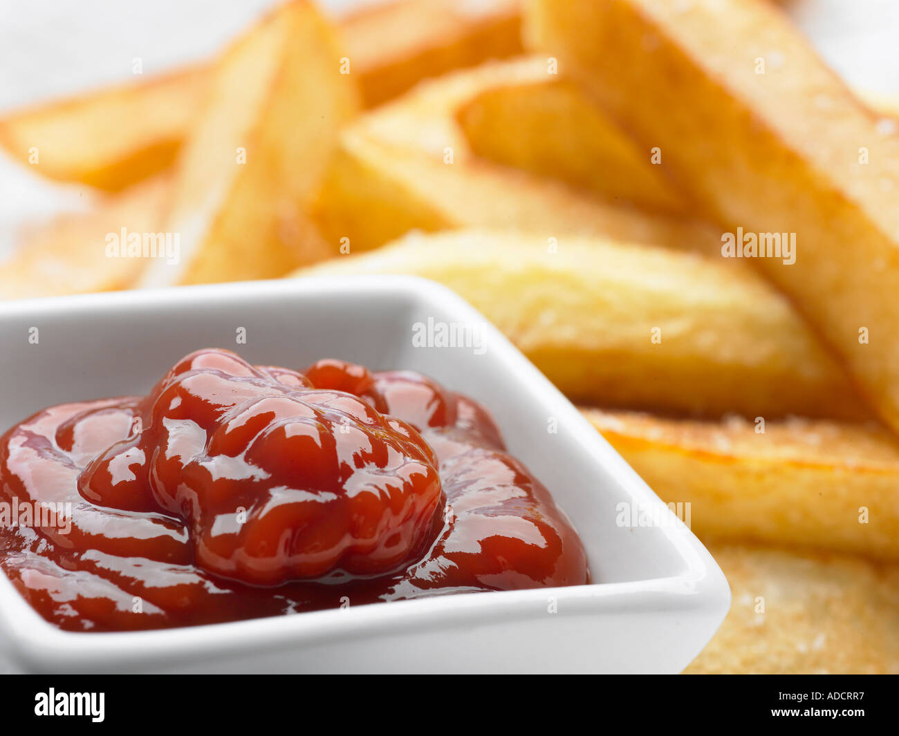 chunky chips and tomato sauce ketchup in dish Stock Photo Alamy