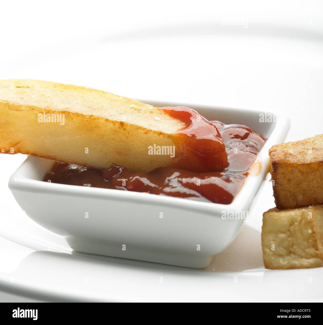 chunky chip laying in tomato sauce ketchup Stock Photo Alamy