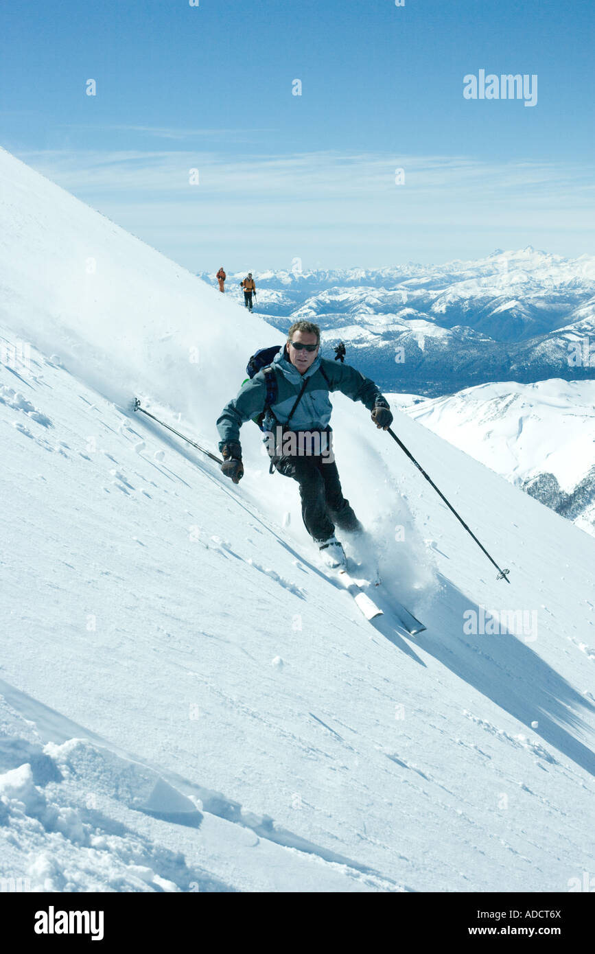 Skier skiing downhill Stock Photo Alamy