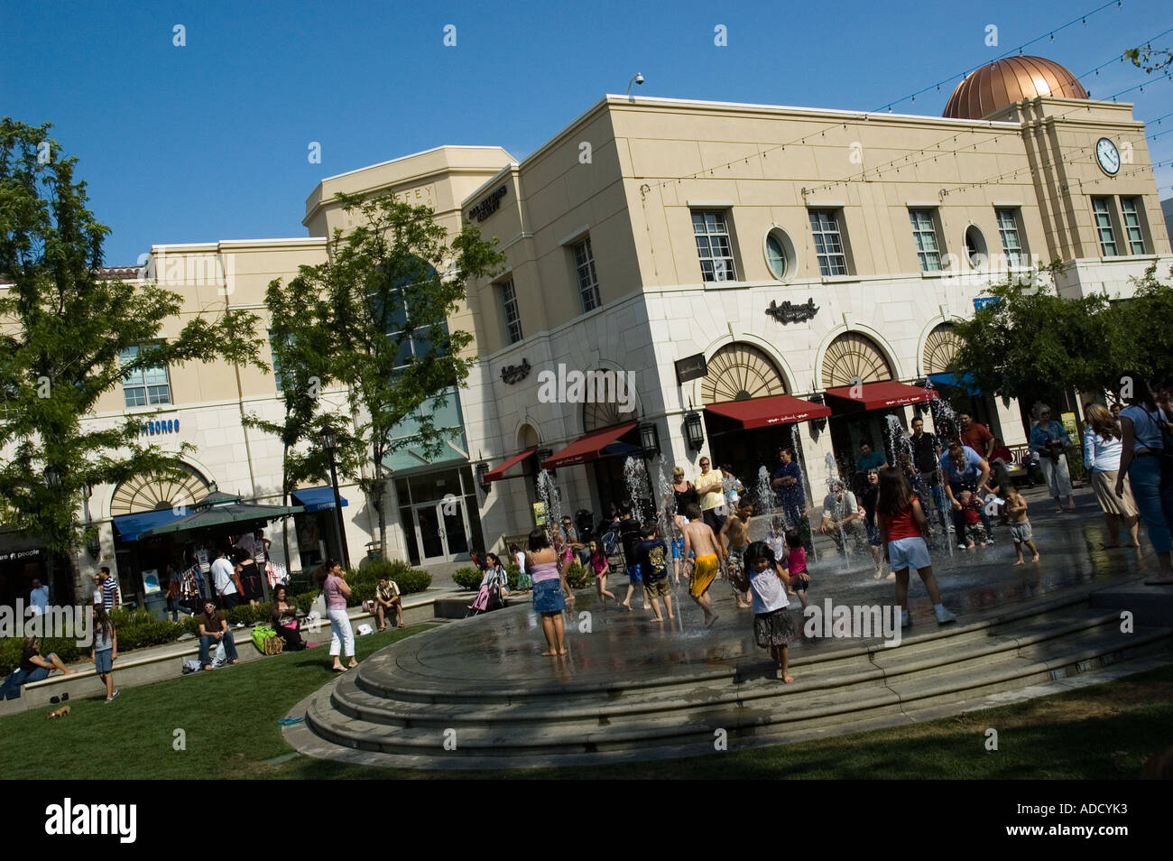 Kids playing and getting wet outside during the summer of 2006 heat