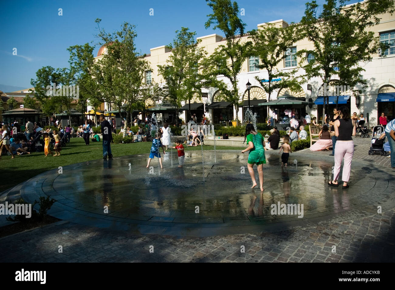Kids playing and getting wet outside during the summer of 2006 heat