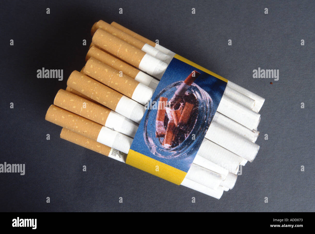 cigarettes cigaretes a bunch of cigarettes with a sign for no smoking symbolic Stock Photo
