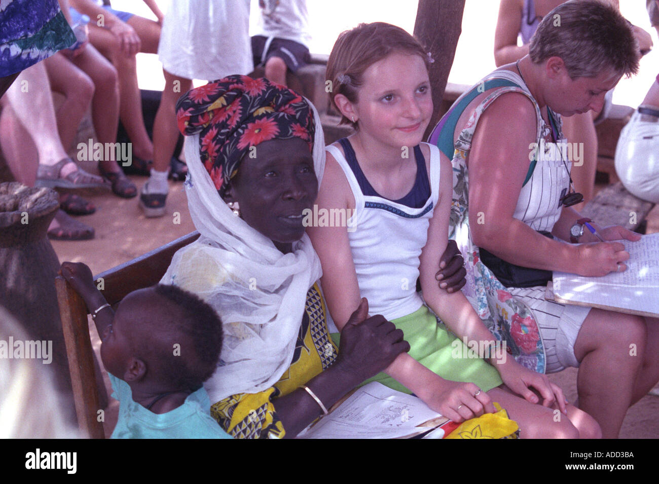 Binte Kinta the oldest known relative of the famous Kunta Kinta with a girl tourist in the Gambian village of Juffure in The Gam Stock Photo