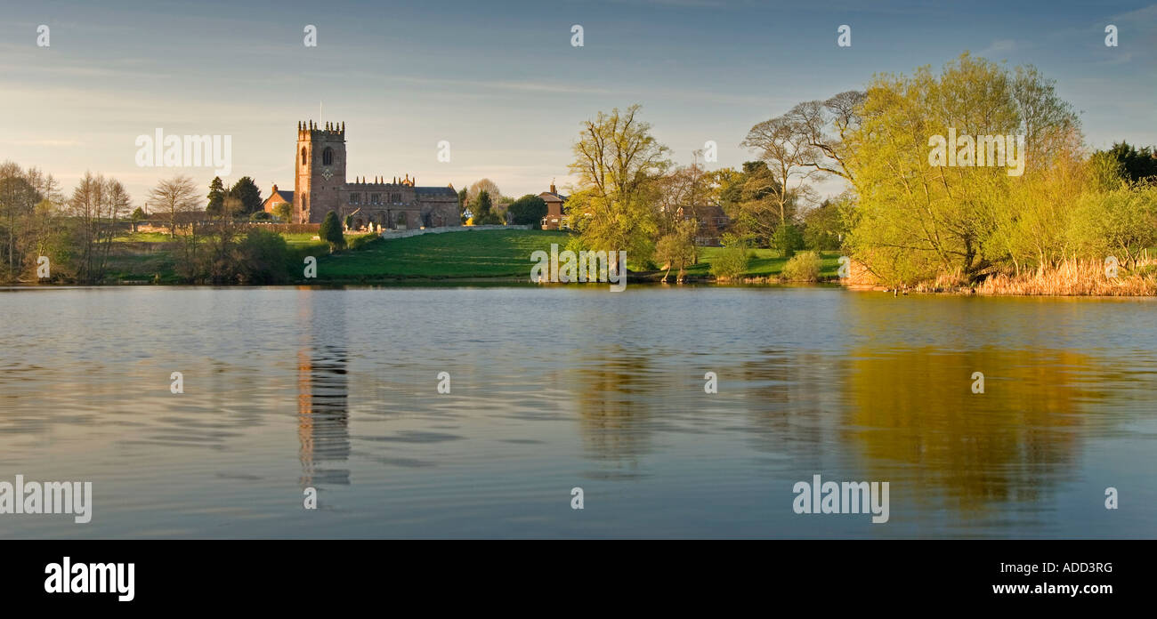 St Michaels Church and Big Mere at the turn of Autumn, Marbury, South Cheshire, England, UK Stock Photo
