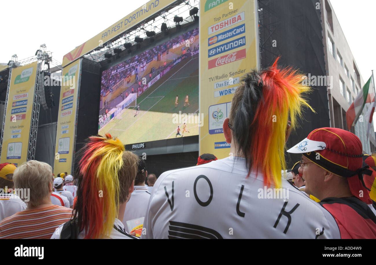 German football fans watching a match at a public viewing event Stock Photo
