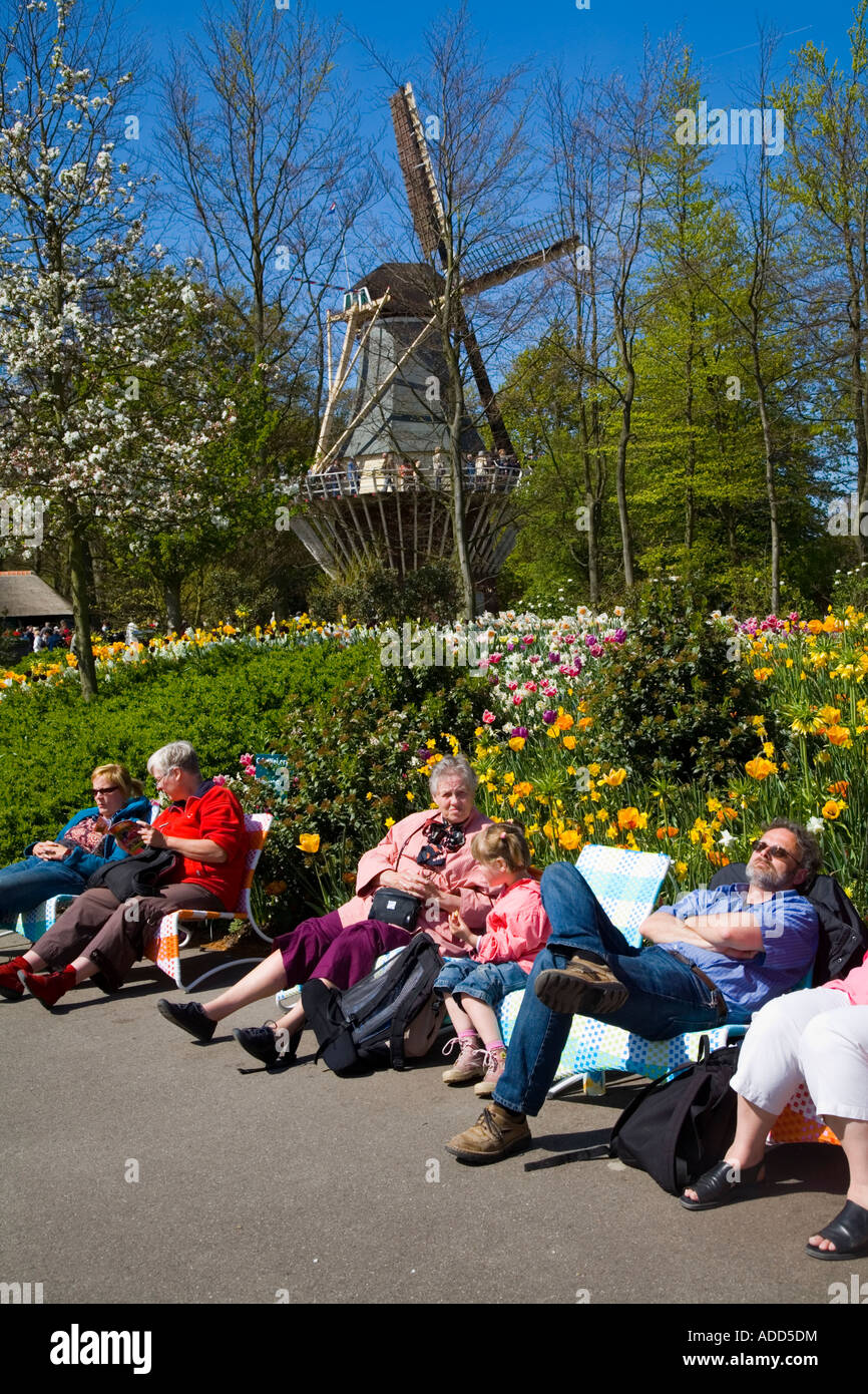 Tourist relaxing in the sun at Keukenhof Gardens in Lisse, Holland;Netherlands Stock Photo