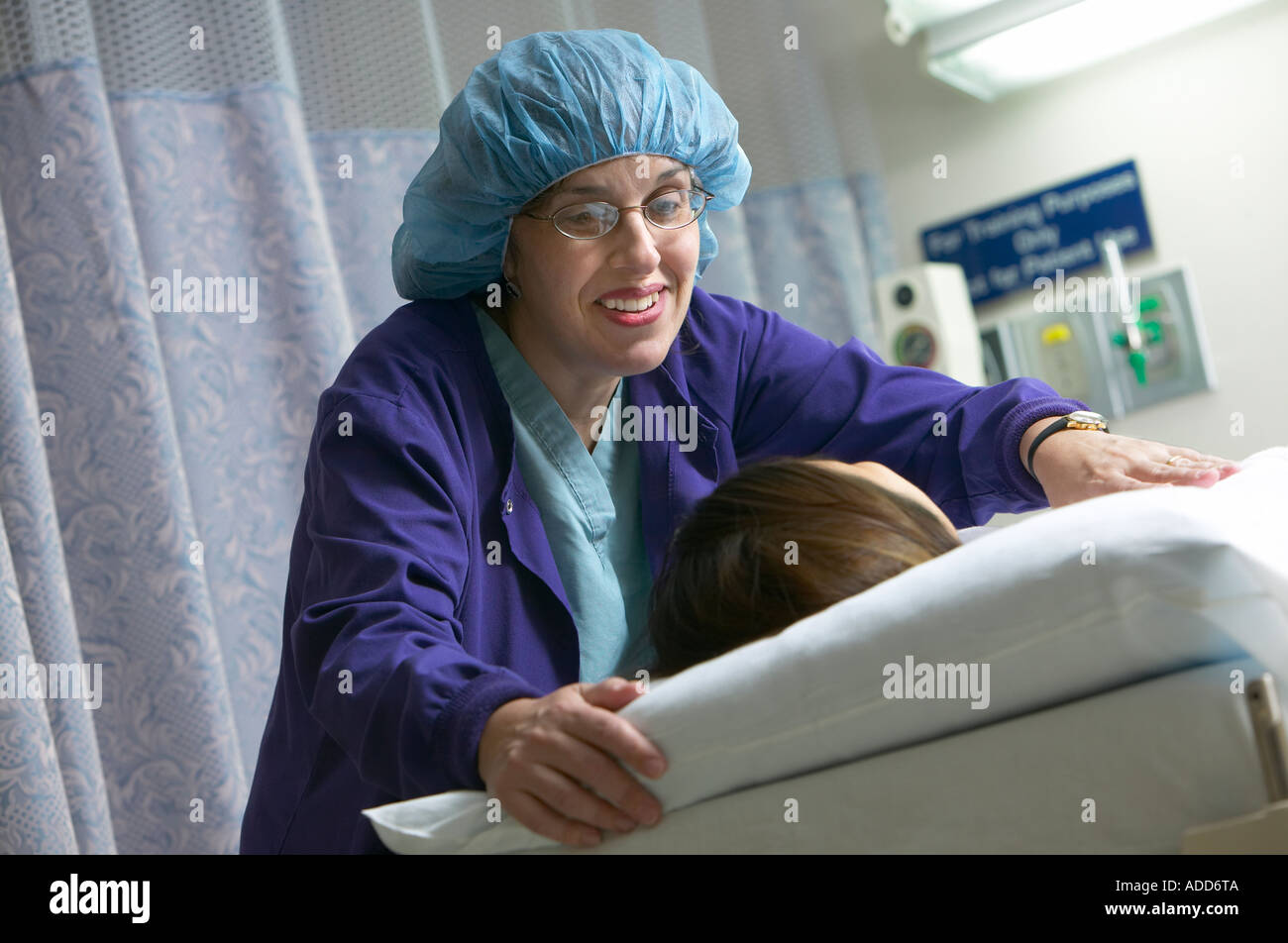Burn Unit nurse comforts patient in bed Stock Photo Alamy