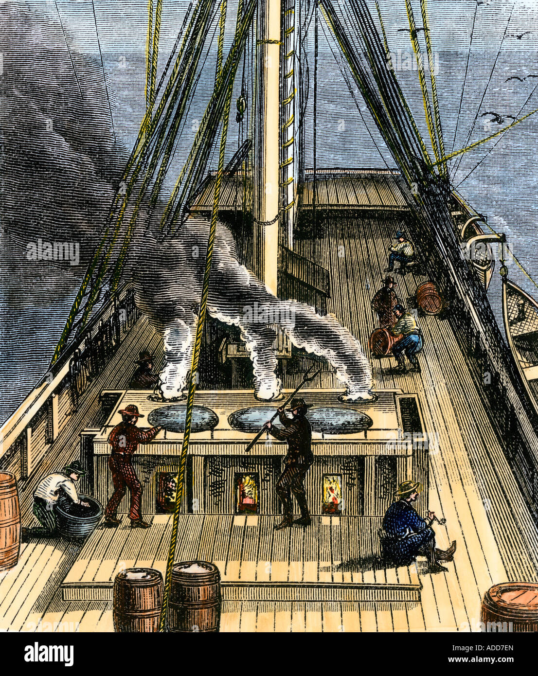 Trying-out, or boiling, whale bubber for oil on a whaling ship 1800s. Hand-colored woodcut Stock Photo