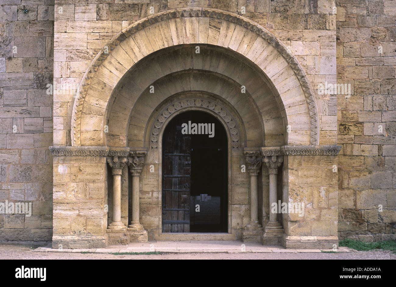 Main doorway of the 12th Century Romanesque church of Santa Maria, Porqueres, Banyoles, Costa Brava, Spain. Stock Photo