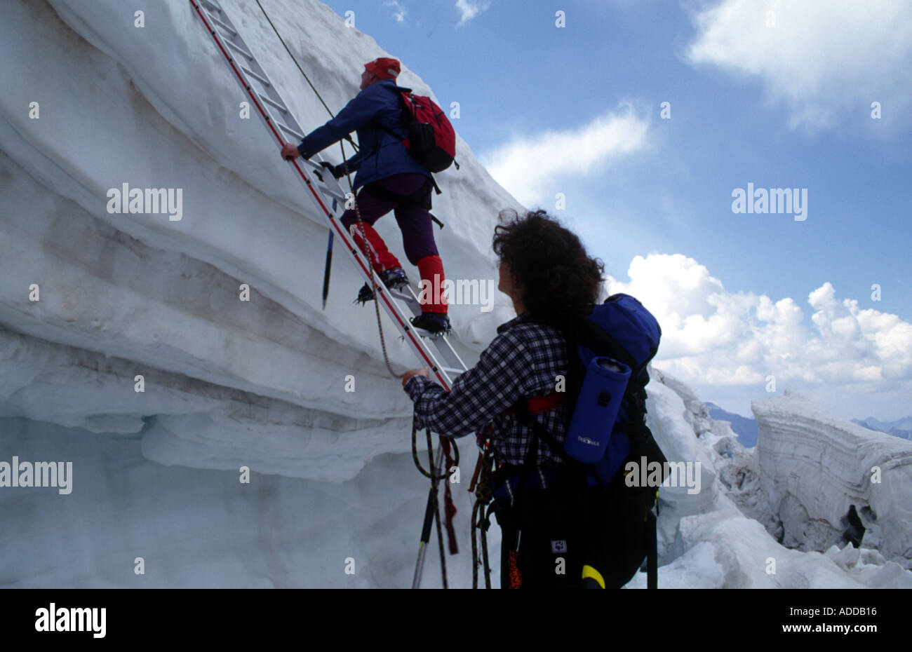 Crossing a Crevasse Swiss Alps Stock Photo