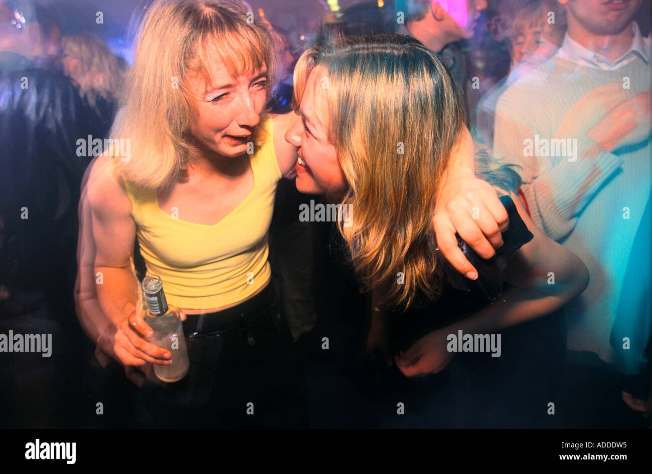 Two girls having a laugh in one of the clubs of Biggs Market Newcastle Stock Photo