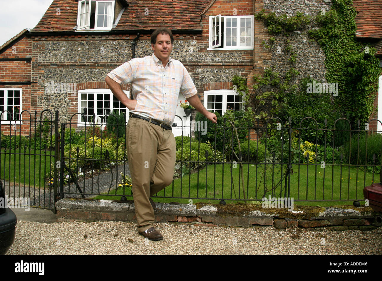 Hambleden Henry Smith, 48, heir to Viscount Hambleden, in front of one