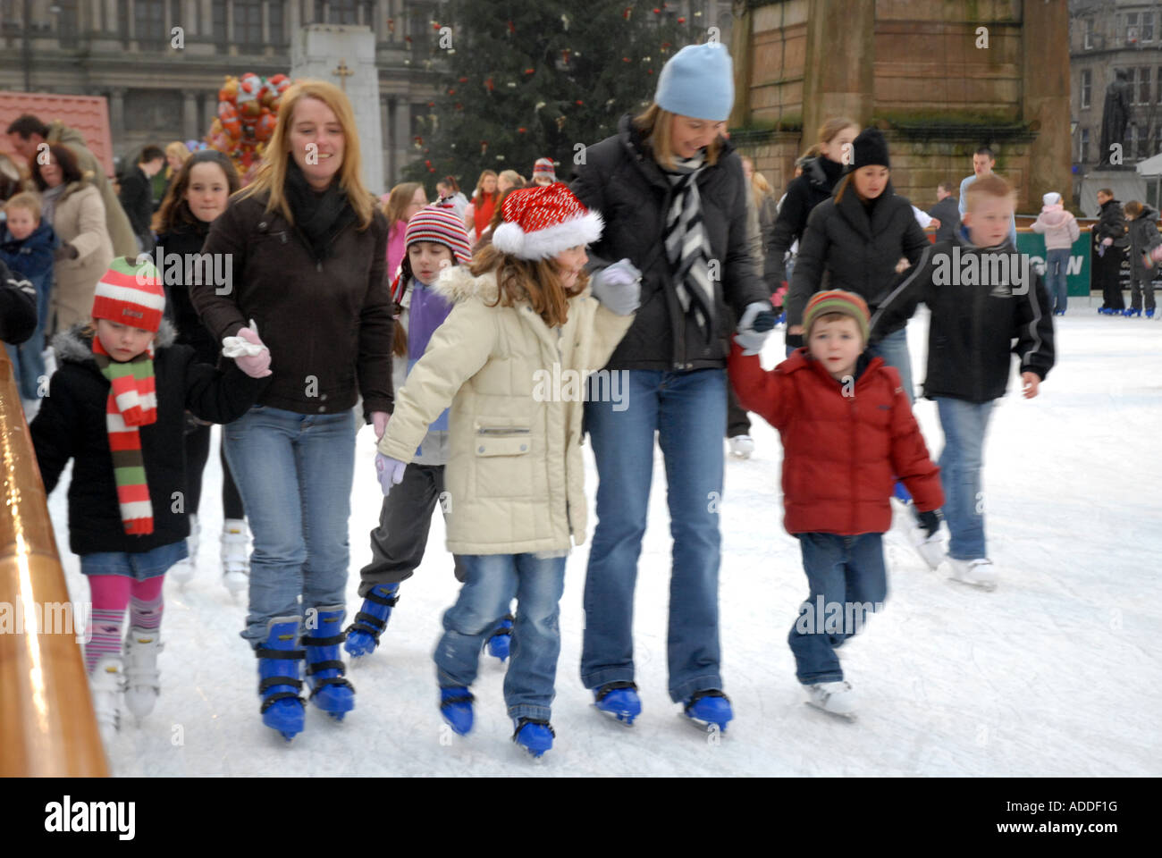 Ice Skating on Outdoor Ice Rink, George Square. Glasgow, Scotland, Dec Stock Photo