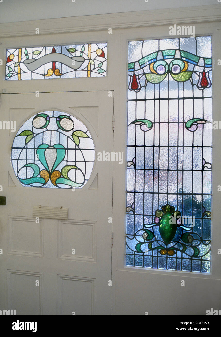 Decorative Edwardian Stained Glass front door taken from interior looking out British Housing