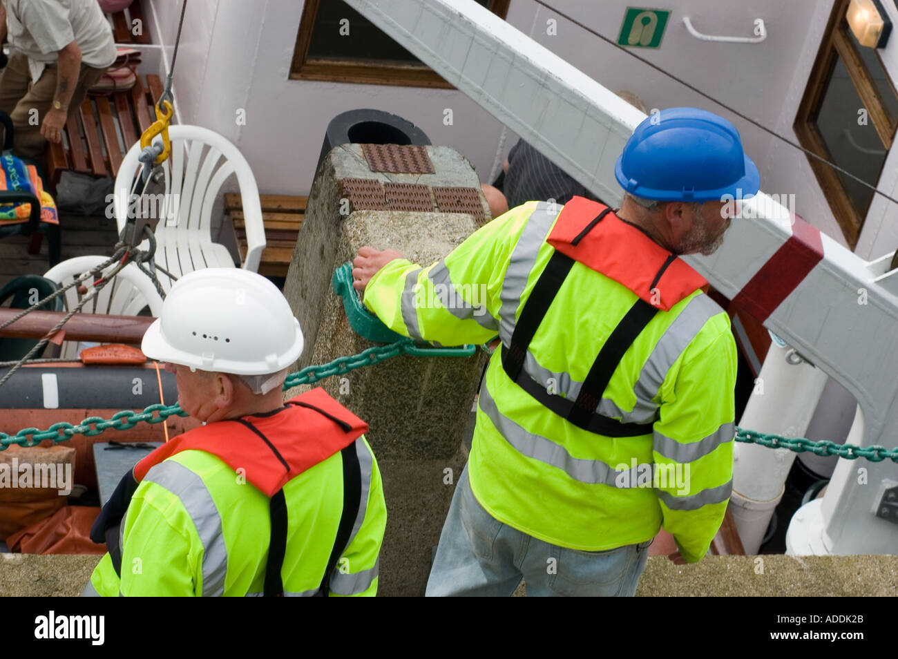 man with beard wearing blue hard hat life belt white workmen great britain Stock Photo Alamy