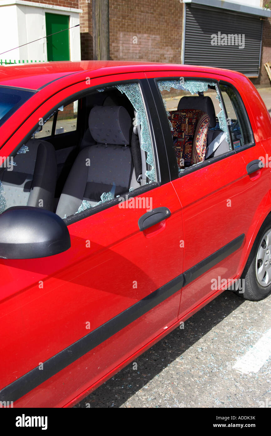 side of red hyundai car with smashed passenger front and rear door