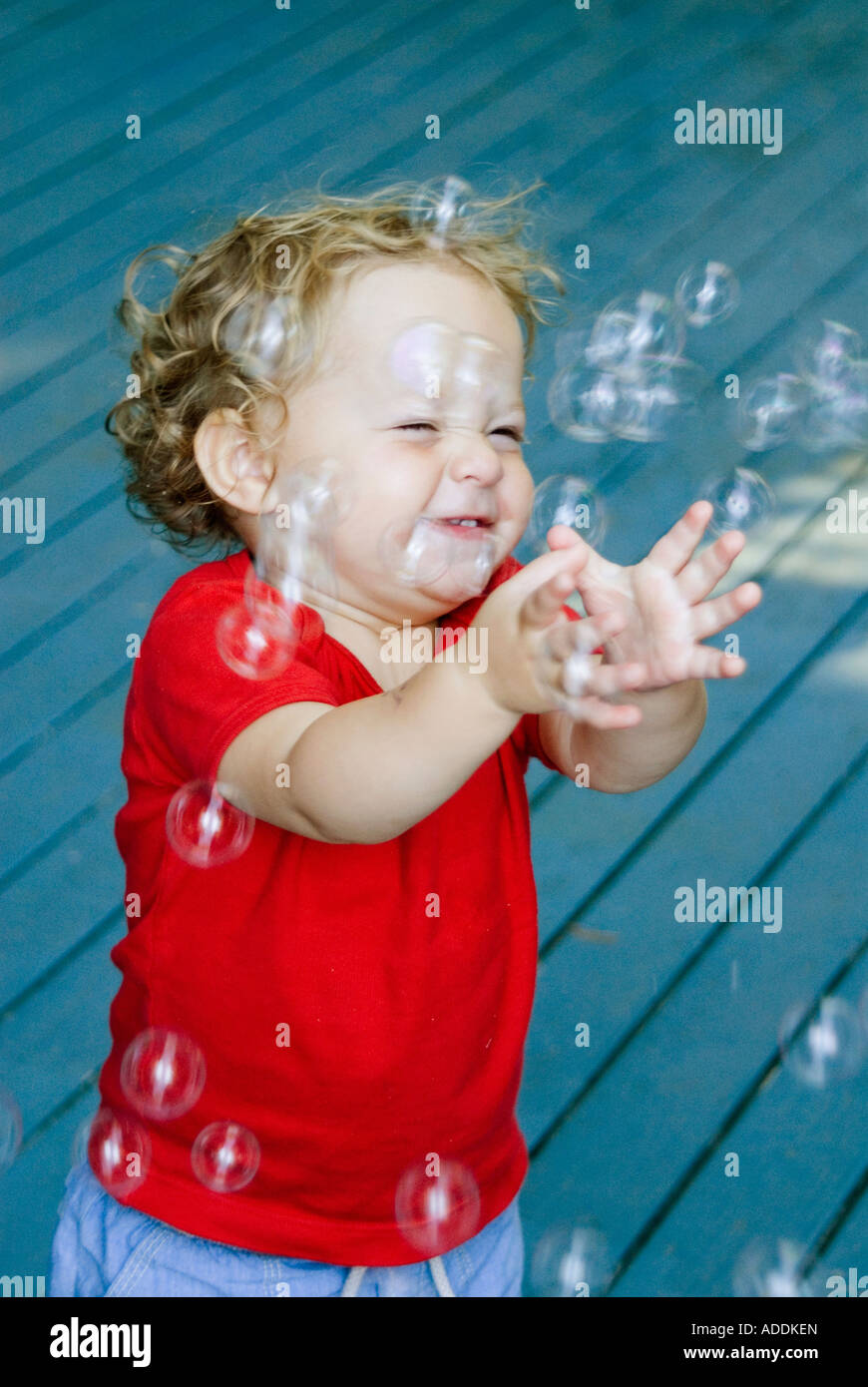 Girl age 2 with bubbles MODEL RELEASED Stock Photo Alamy