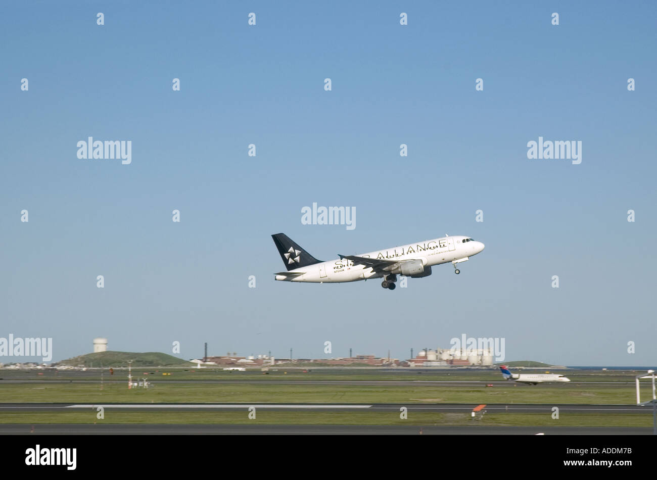A Star Alliance passenger jet taking off from Logan International Airport in Boston Massachusetts Stock Photo