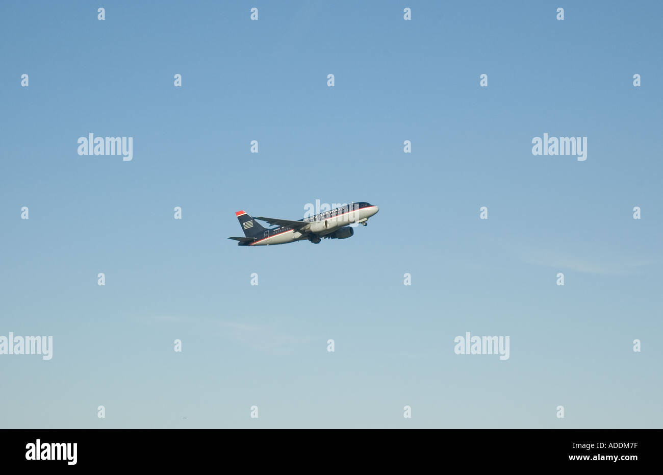 A US Airways passenger jet taking off from Logan International Airport in Boston Massachusetts Stock Photo