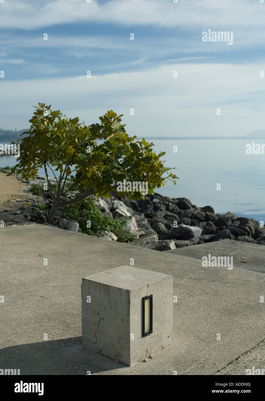 Cement block near edge of lake Stock Photo Alamy