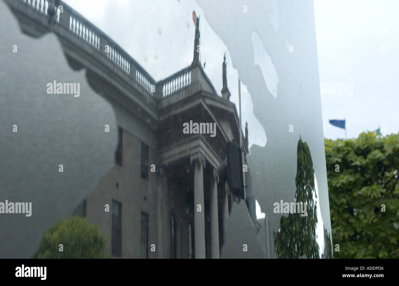 A reflection of the General Post Office in Dublin can be seen in the base of the city s new Millenium Spike monument Stock Photo