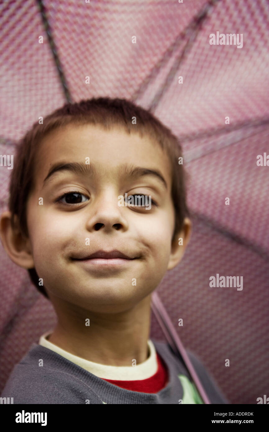 Smiling boy with umbrella Stock Photo