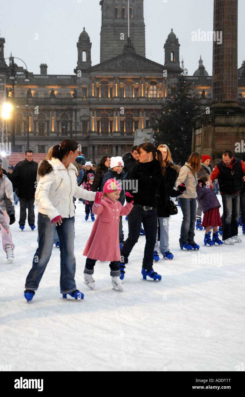 Ice Skating on Outdoor Ice Rink, Square. City Chambers in