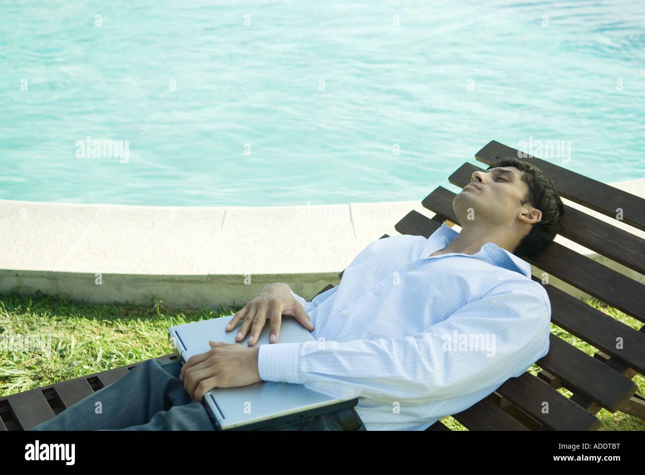 Businessman reclining on lounge chair Stock Photo Alamy