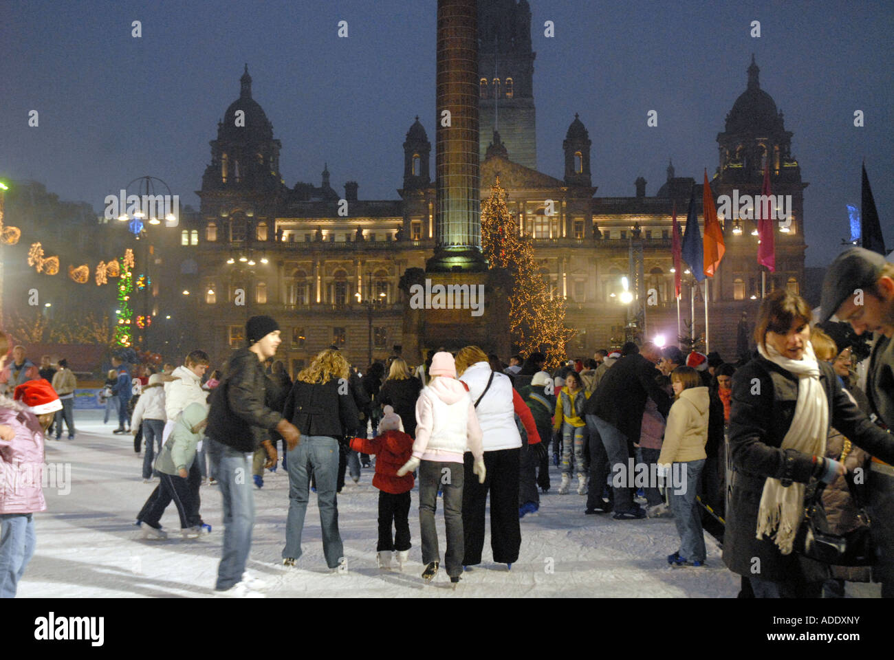 Ice Skating on Outdoor Ice Rink, Square. City Chambers in