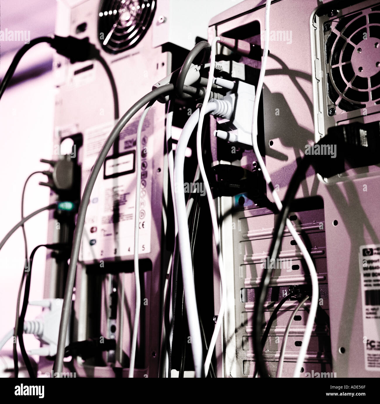 jumble of wires and cables hanging from computers Stock Photo Alamy